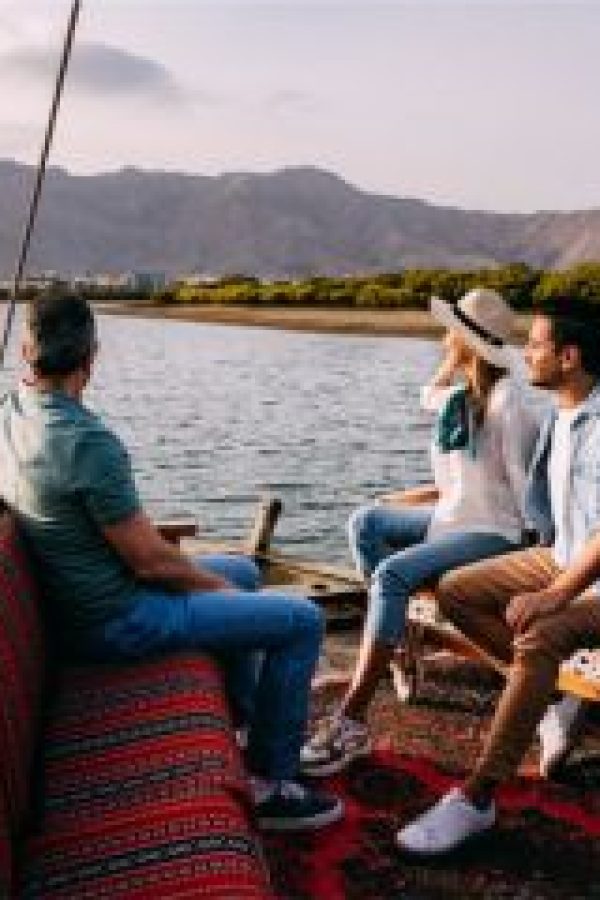 Visitors enjoying a traditional wooden boat ride at Suwaidi Pearl Farm in Ras Al Khaimah